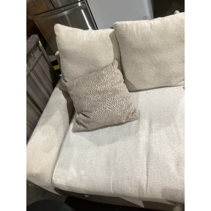 Lot # 2307 Beige Model Beige Cushioned Sofa $800