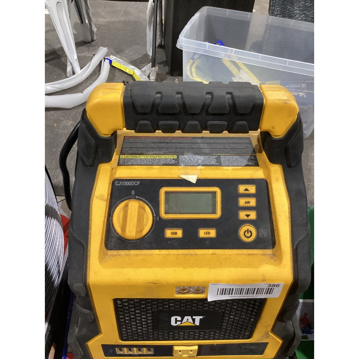 Lot # 386 CAT CJ1000DXT 1200 Peak Amp Jump Starter and Powerstation $169