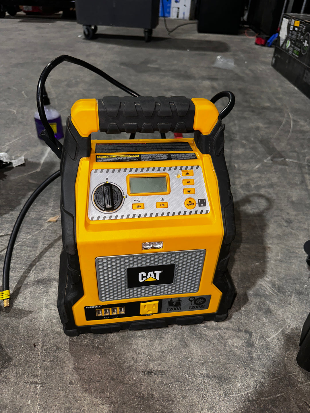 Cat Power Station with 1,200-Peak-Amp Jump Starter, Tire Compressor, and Power Inverter, CJ1000DXT (Used)