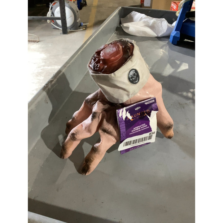 Lot # 856 Haunted Living Animated Zombie Hand $25.00