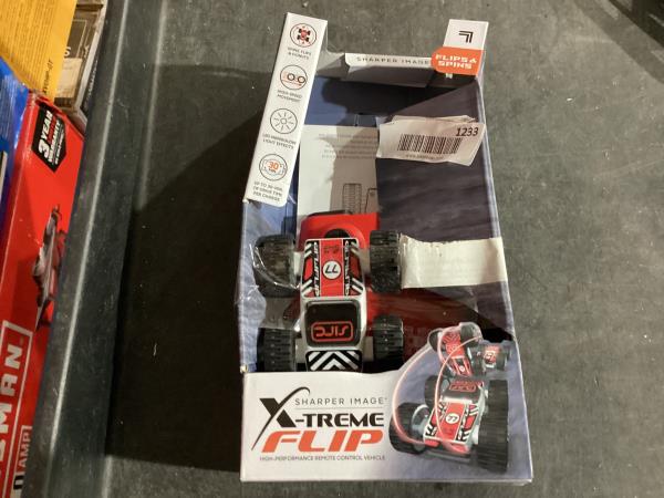 Lot # 1233 Sharper Image® Toy RC X-Treme Flip High-Performance Remote Control Vehicle with Double-Sided Driving, LED Lights, Performs Spins, Flips & Donuts, 3-Pieces, Blue, Age 6+